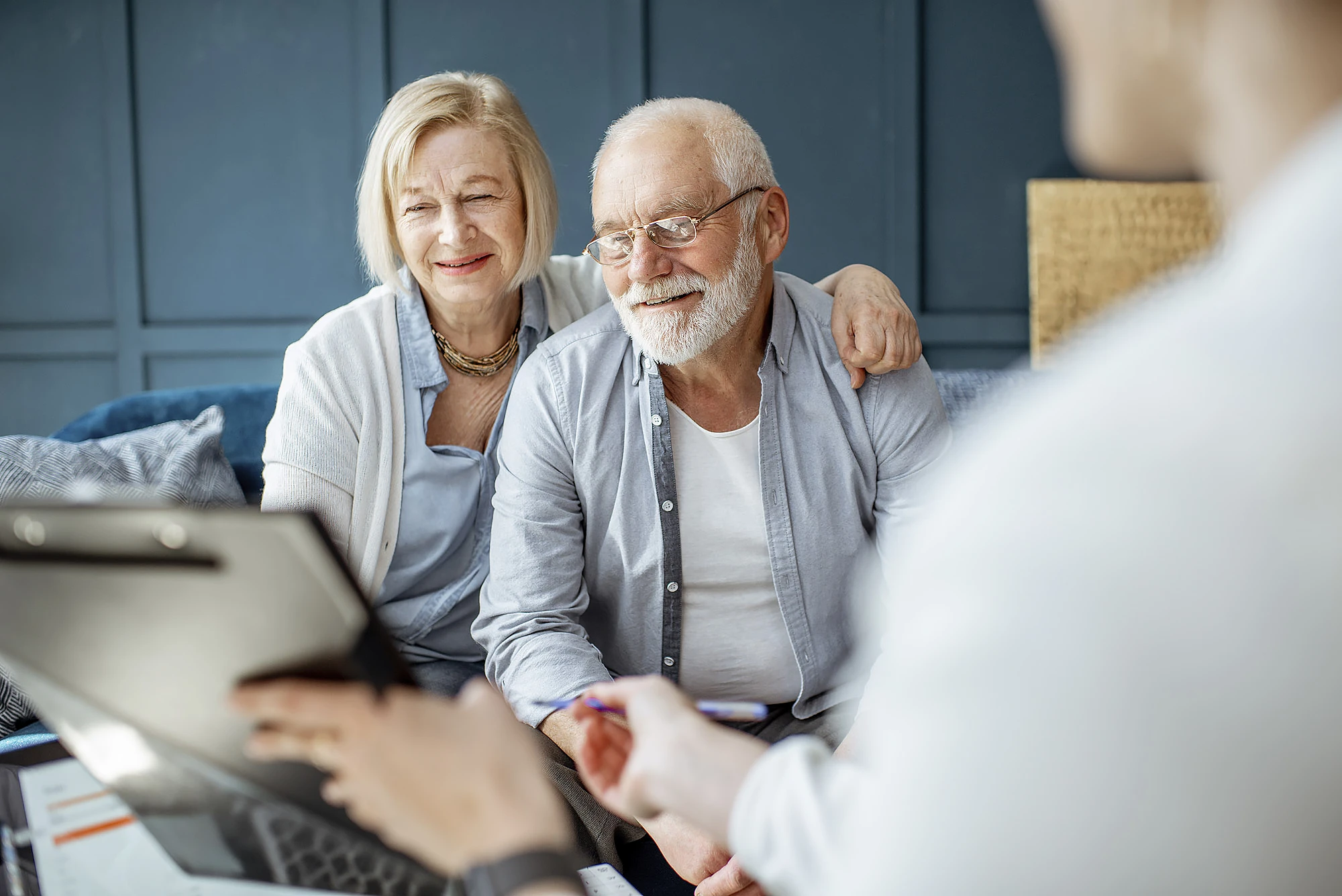 Employee Benefits A pair fist-pumping in an office