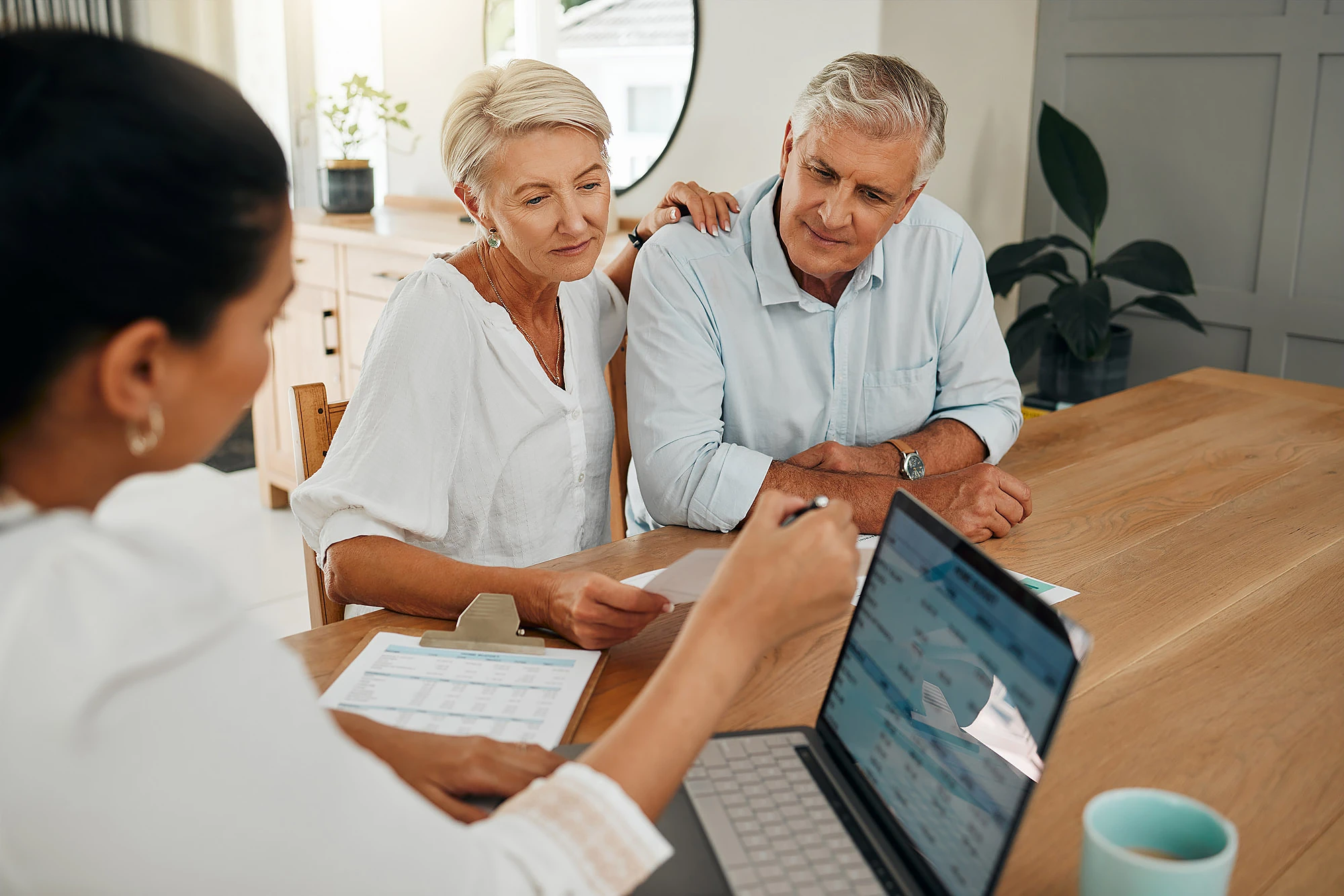 Employee Benefits A pair fist-pumping in an office